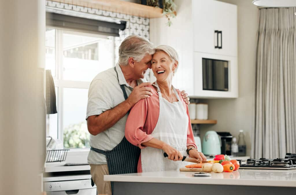 senior couple in kitchen cooking healthy food tog 2022 12 10 00 22 08 utc (1)